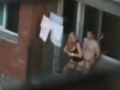 Voyeur captures the neighbors having sex on the balcony