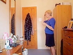 Wearing a blue skirt and flashing her tits