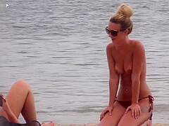 Athletic topless babe in thong filmed with her tits out in public