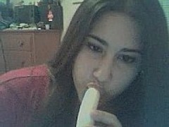 Anastasia sucks a banana