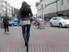 High heel black boots and tight jeans