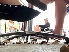 Candid flats dangling under table