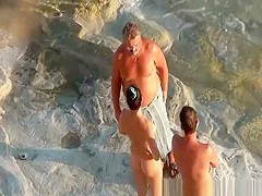 Nudist couple handjob and pussy eating