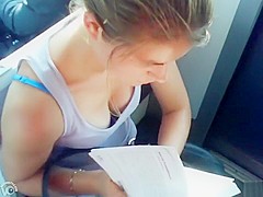 Great cleavage on a chick reading on the train