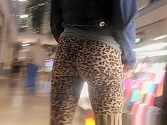 Teen in leopard leggings at the shopping mall