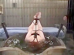 Claire Adams tied up and punished in Water Bondage