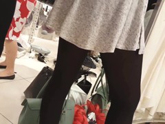 Sexy girl in super mini skirt and black tights