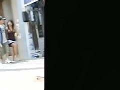 Public upskirt shot of a woman wearing pink panties