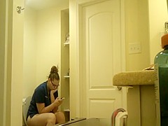 Chubby nerd girl in toilet