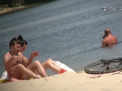 Flat chested brunette and mature blonde on beach voyeur vid