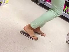 Candid feet painted toes in Flip Flops