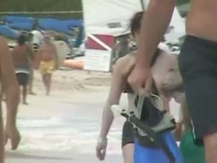 Various females on the beach tanning in a porno compilation