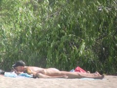 Beach nudist hunter voyeuring nude bodies from behind bushes