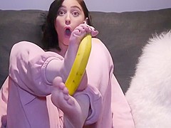 Peeling a banana with her feet