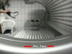 Hidden cam catches hot babe rubbing her pussy at the tanning saloon