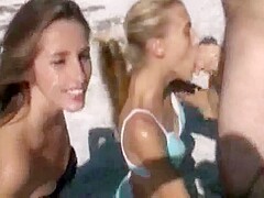 Double blowjob and facial on the beach
