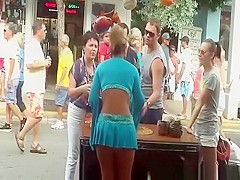 Hot blonde in short blue skirt wind upskirt