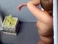 Cute chubby girl lotions up before a tan