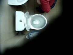 A hidden spy cam catches a chick pissing