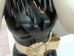 Big Tits Girl In Black Latex Catsuit + Mask + Gloves Piss In Golden Boots