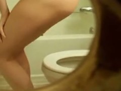 Naked girl with full boobs pissing on toilet getting spied