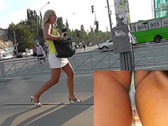 Upskirt panties of the tanned blonde mature lady
