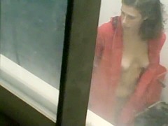 Office maid spied during a shower