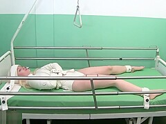 Straitjacket in bed