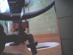 Girl in leather boots is getting spied pissing on toilet