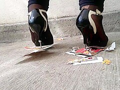 Girl trampling stomping on picture in metal high heels