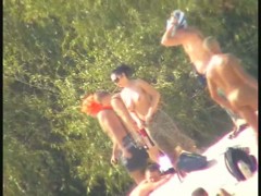 Busty nudist beach MILF caught on a hidden cam