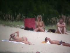 Busty blonde nude beach MILF spied on by a voyeur