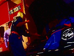 Tied up man gets used by a slutty blonde lady in red