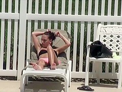 Voyeur spies a girl by the swimming pool