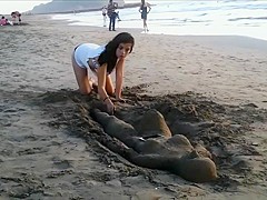 Sexy young brunette gets jizzed at the beach by stranger