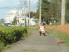 Aya walking around with ripped up skirt near road