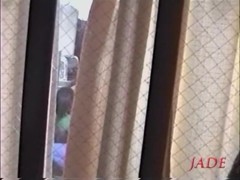 Busty Jap whore seen fucking hard through a window