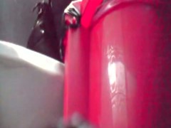 Close distance toilet spy cam of a woman pissing