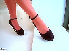 Beautiful blonde in black shoes with high heels, Tiffany Tatum is using her feet to satisfy men