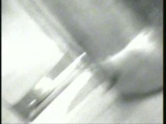 Thin woman pissing in a public toilette
