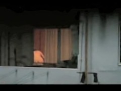 Horny neighbor nude and voyeured through window