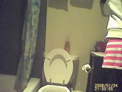 Hidden piss cam in the home toilet shows peeing sister
