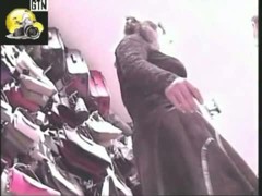 Dark haired woman upskirt porno in a purse shop voyur hidden cam