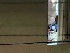 Watching my neighbor's wife undress