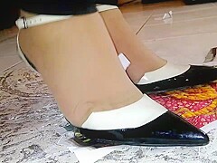 Girl stomping on paper and trampling in metal high heels