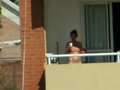 girl sunbathing topples un bacony in argentina.