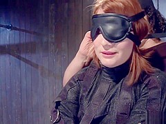 Redhead in strait jacket fucks dildo