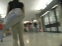 A brunette with appetizing ass in the street candid video