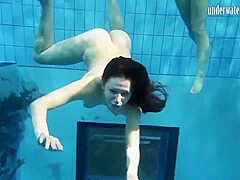 Girls Andrea And Monica Stripping One Another Underwater