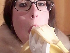 Spex brunette talking dirty while eating banana by Femdom Austria